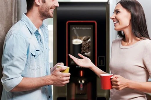 freestanding-coffee-machine freestanding office coffee machine with people enjoying a hot beverage