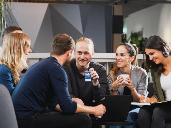 employeeengagement-intro group of people enjoying office coffee